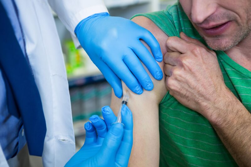 Pikwizard Pharmacist Giving Injection To Patient