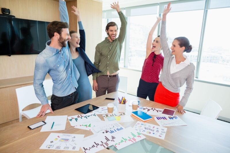 pikwizard-smiling-business-executive-having-fun-in-conference-room