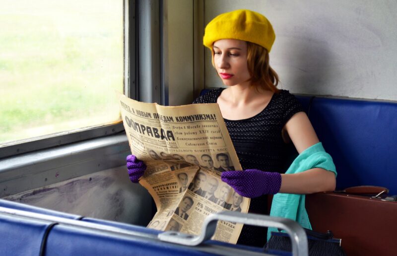 Newspaper Reading Woman